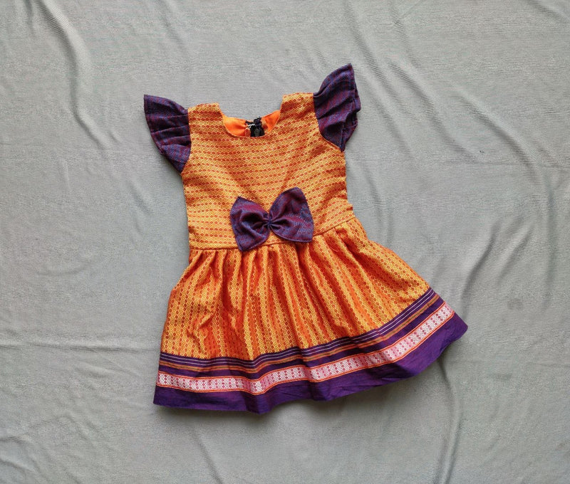 Girls orange Khunn frock with purple Bow - WEAR COURAGE